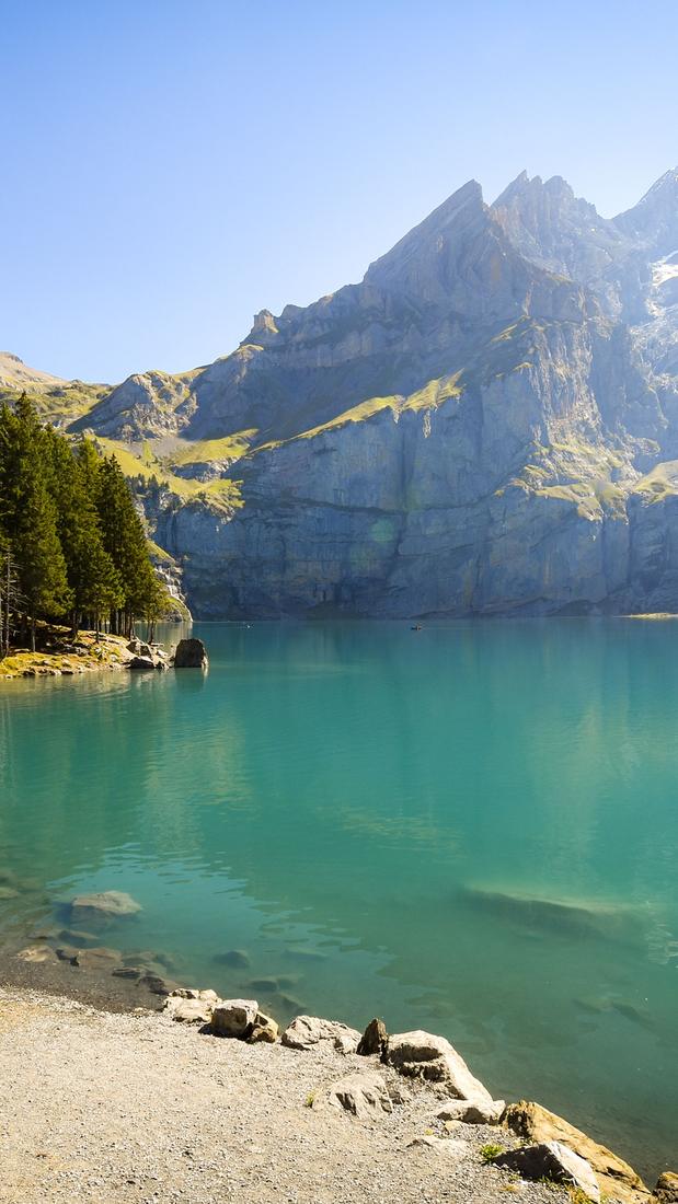 A turquoise mountain lake framed by trees